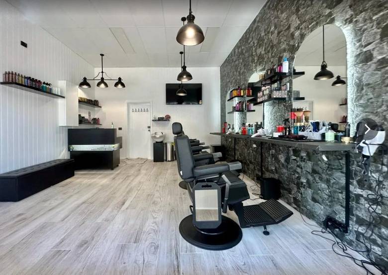 Big Boy Barber interior, stone wall and barber chair